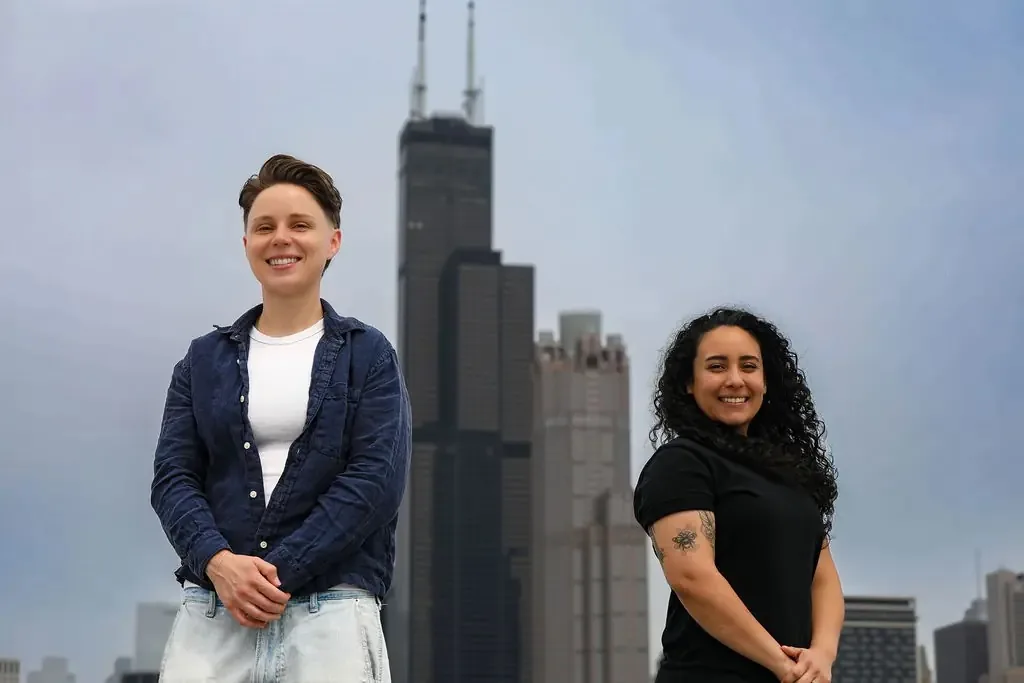 Karen Rodriguez and Alexa Cardello of Dello Investments on the front steps of a Chicago home