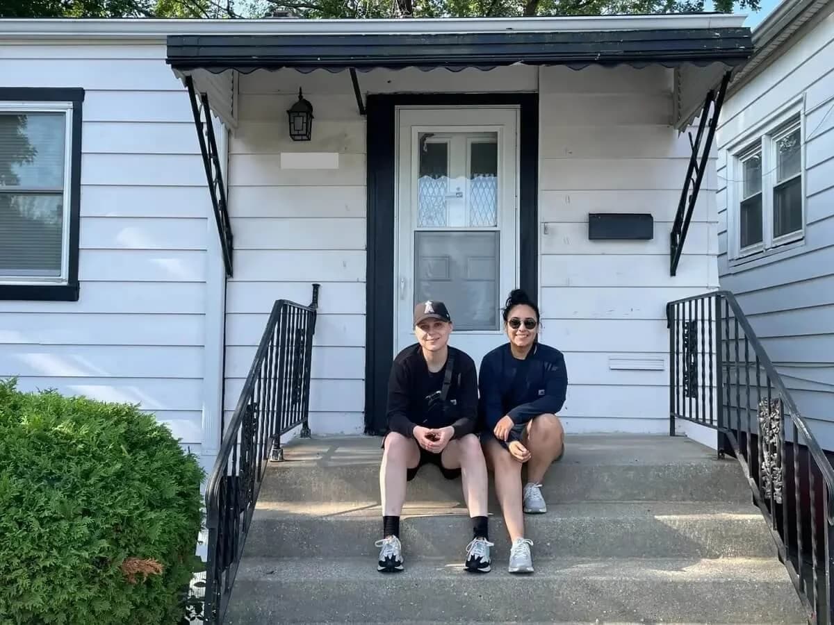Karen Rodriguez and Alexa Cardello of Dello Investments on the front steps of a Chicago home